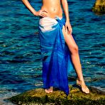 Pic of Aquamarine A revealing her small tits on by the ocean