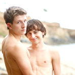 Pic of Cole Claire and Oliver Saxton are frolicking on the beach in super sexy tiny swim trunks