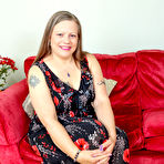 Pic of Curvy mature lady masturbating in her livingroom