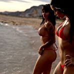 Pic of Mareeva & Trudy taking off their red bikini's on the beach
