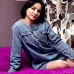 Pic of Petite college girl Naja parts her tight pussy lips after getting naked in bed