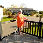 Pic of Fat nan bares her boobs while in a patio hot tub before getting naked on a bed