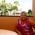 Pic of Obese grandmother GrandmaLibby parts her labia lips after disrobing on balcony