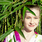 Pic of Sexy little geisha Emily Bloom spreading naked to show bald twat in the bamboo