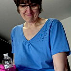 Pic of Amateur woman Hotmilf wears latex gloves while giving an oily handjob