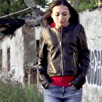 Pic of Petite brunette Natasha squats for a piss in a puddle on a gravel road