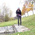 Pic of Brunette chick Freya Dee takes a pee on a retaining wall on a chilly day