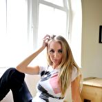 Pic of Blonde amateur Hayley Marie Coppin displays her nice tits by a window