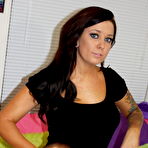 Pic of Tattooed brunette Lilly works her tits and pussy free of a little black dress