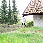 Pic of White girl Victoria Daniels pulls down black tights to pee outside of a chalet