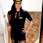 Pic of 30 plus Latina chick Julie Ann peels off pilot uniform to pose nude in hosiery
