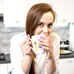 Pic of Young beauty Jolie gets totally naked over a cup of coffee in her kitchen
