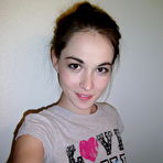 Pic of Cute brunette Emily undressing to take self shots of her bare tits and hot ass