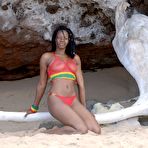 Pic of Ebony girl Diamaa gets completely naked on weathered driftwood upon a beach