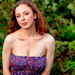 Pic of Beautiful teen Esenia slips out of her dress to go nude in a field