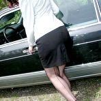 Pic of Horny female Dirty Angie fingers her pussy in retro style lingerie inside car