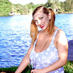 Pic of Chesty MILF pornstar Autumn Jade toying and masturbating bald cunt outside