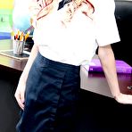 Pic of Blonde schoolgirl Skylar Green strips to knee socks and sneakers on a desk