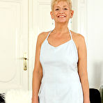 Pic of Horny older granny Scarlett J gets naked to fondle saggy tits & spread legs