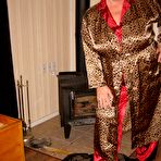 Pic of Old amateur Girdle Goddess gets naked in front of a parlour stove