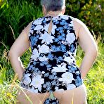 Pic of Silver haired granny Savana gets naked outdoors on a blanket in stockings