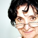 Pic of Naughty granny in glasses masturbating her twat with a dildo