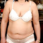 Pic of Fatty granny taking off her lingerie and posing in white stockings