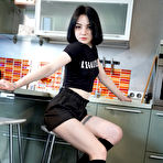 Pic of Dark haired teen Candy Black masturbates with a vibrator in black knee socks