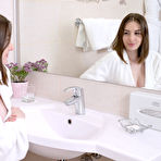 Pic of Nice teen Lillie Pie removes a white bathrobe before bathing in the buff