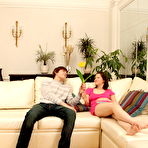Pic of Young brunette receives a money shot after having sex on a sofa