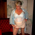 Pic of Obese nan Girdle Goddess uncrosses nylon clad legs to expose her twat
