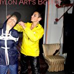 Pic of Shinynylonartsbound | Sandra tied and gagged overhead with ropes and a ballgag overhead prepared to be hunged up by Stella both wearing sexy shiny nylon rainwear (Pics) PART1of 2